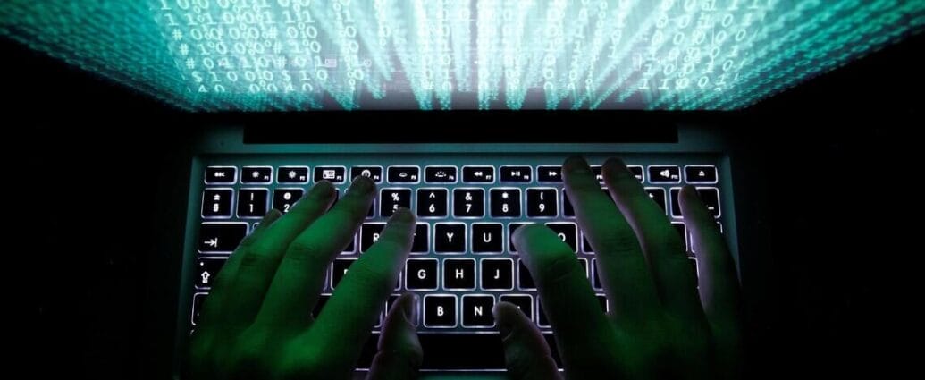 Hands typing on laptop keyboard with binary code, symbolizing cybersecurity and hacking. | Cyberinsure.sg